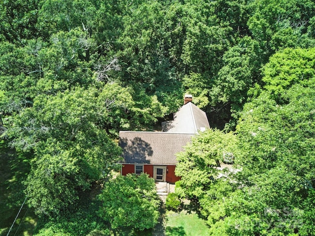 105 Edgewood Cir NE, Concord, NC 28025 - aerial view of property and surrounding area featuring a heavily wooded area