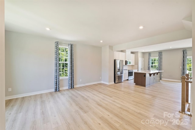 342 Cramerton Mills Parkway, Cramerton, NC 28032 - unfurnished living room with light wood-style floors and recessed lighting