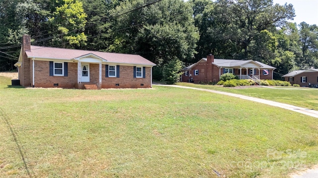 120 Lafayette Rd, Stanley, NC 28164 - ranch-style home with crawl space, a front yard, brick siding, a chimney, and view of scattered trees