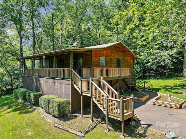 250 Turkey Pen Rd, Franklin, NC 28734 - back of property with stairway and a lawn
