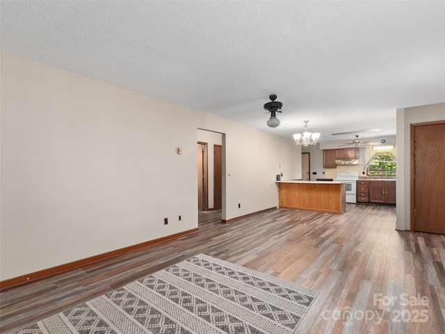 250 Turkey Pen Rd, Franklin, NC 28734 - unfurnished living room featuring light wood finished floors and a chandelier