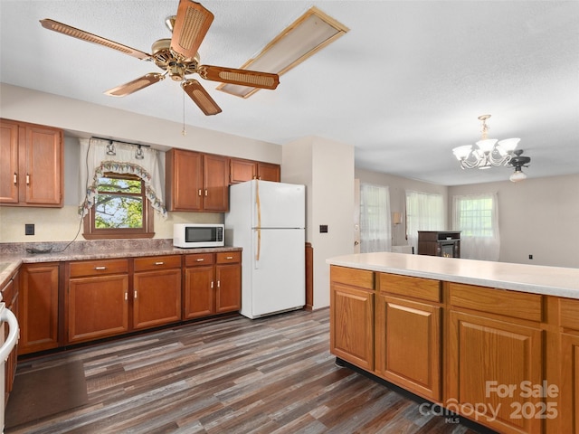 250 Turkey Pen Rd, Franklin, NC 28734 - kitchen with white appliances, brown cabinetry, and healthy amount of natural light