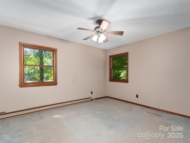 250 Turkey Pen Rd, Franklin, NC 28734 - empty room featuring a baseboard radiator, light colored carpet, a ceiling fan, and a textured ceiling