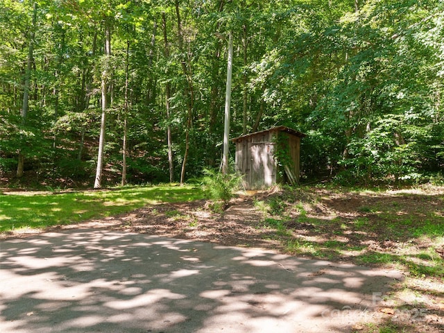 250 Turkey Pen Rd, Franklin, NC 28734 - view of yard featuring a shed and a view of trees