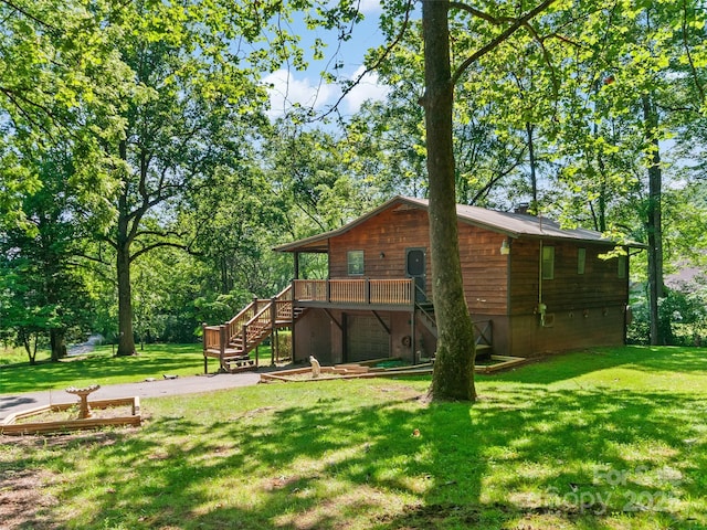 250 Turkey Pen Rd, Franklin, NC 28734 - back of house with stairs, a garage, a yard, and a deck