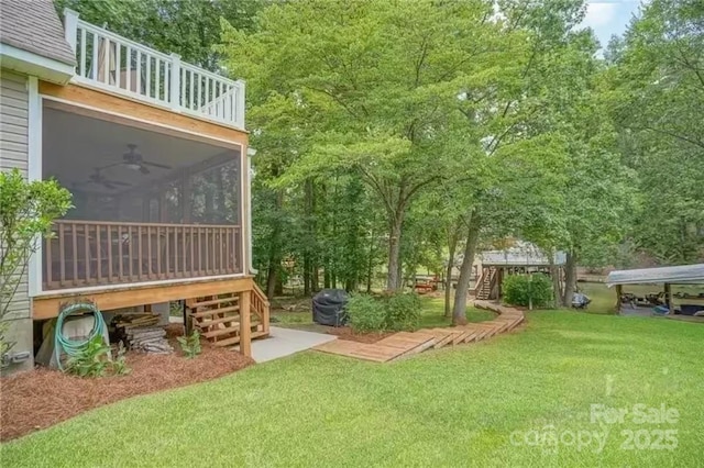 696 Springwood Dr, Mount Gilead, NC 27306 - view of green lawn with stairway, a sunroom, and a balcony