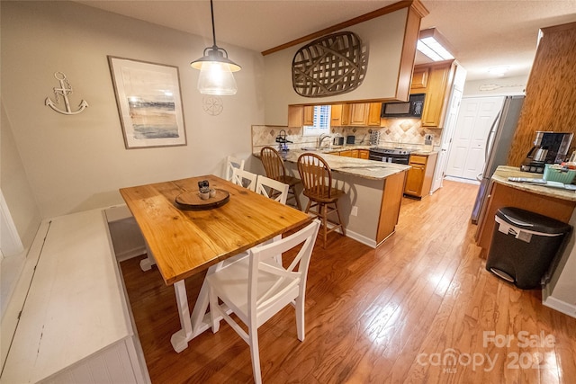 696 Springwood Dr, Mount Gilead, NC 27306 - dining space featuring light wood finished floors