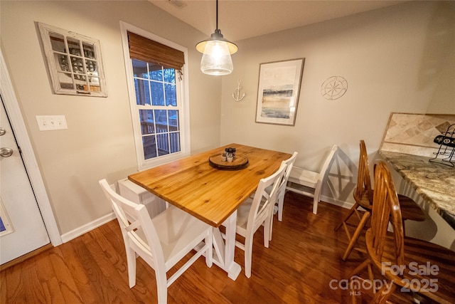 696 Springwood Dr, Mount Gilead, NC 27306 - dining area featuring wood finished floors and baseboards