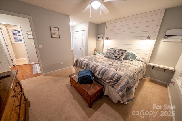 696 Springwood Dr, Mount Gilead, NC 27306 - bedroom featuring light colored carpet, a closet, and a ceiling fan