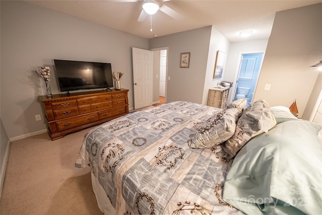 696 Springwood Dr, Mount Gilead, NC 27306 - bedroom featuring light carpet, connected bathroom, and a ceiling fan