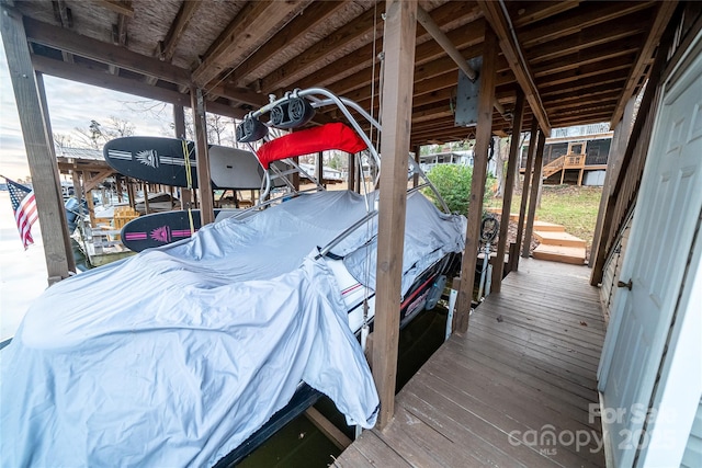 696 Springwood Dr, Mount Gilead, NC 27306 - deck featuring boat lift and a boat dock