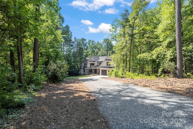 2866 Backwoods Trl, Denver, NC 28037 - view of front of house featuring driveway, a garage, and a view of trees