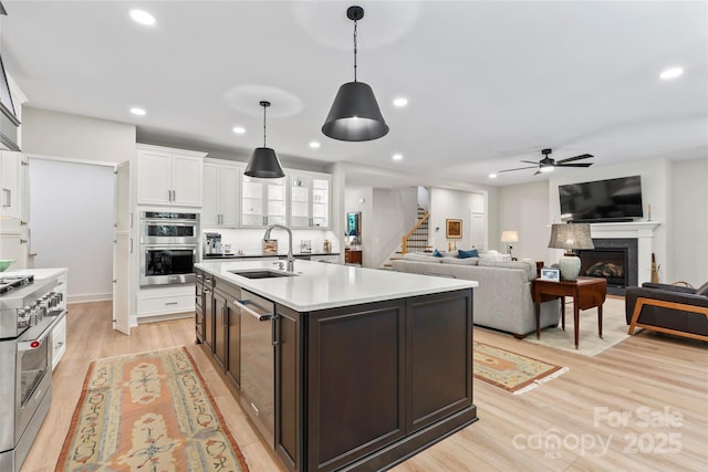 2866 Backwoods Trl, Denver, NC 28037 - kitchen featuring appliances with stainless steel finishes, recessed lighting, white cabinetry, a ceiling fan, and light countertops