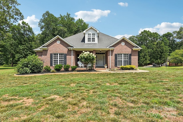 3865 Willow Grove Ln, Concord, NC 28025 - view of front facade with brick siding, a front lawn, and a porch