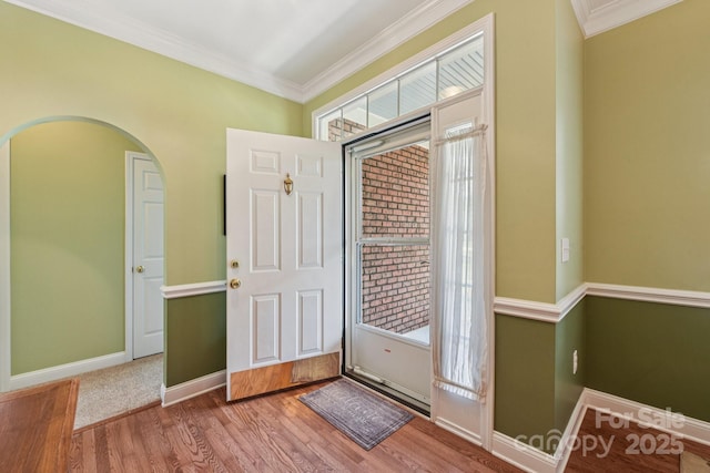 3865 Willow Grove Ln, Concord, NC 28025 - entrance foyer featuring wood finished floors, crown molding, and arched walkways