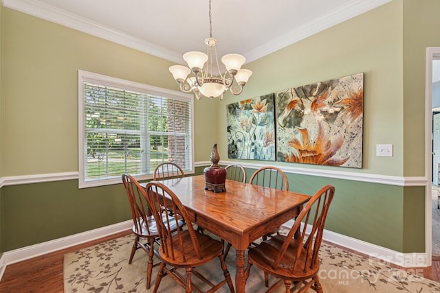 3865 Willow Grove Ln, Concord, NC 28025 - dining area featuring crown molding, a chandelier, and wood finished floors