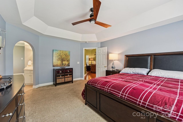 3865 Willow Grove Ln, Concord, NC 28025 - bedroom with a tray ceiling, light carpet, arched walkways, and ceiling fan
