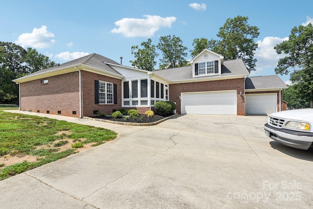 3865 Willow Grove Ln, Concord, NC 28025 - view of front of home with brick siding, concrete driveway, a sunroom, and a garage