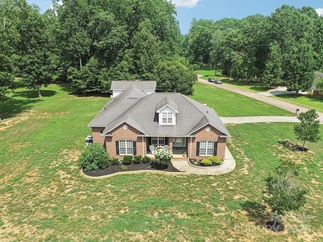 3865 Willow Grove Ln, Concord, NC 28025 - view of front of property with brick siding, covered porch, and a front yard
