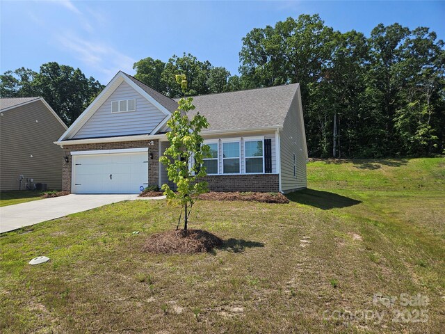 368 Saddlebred Ln, Locust, NC 28097 - view of front of property with brick siding, driveway, a garage, and a front yard