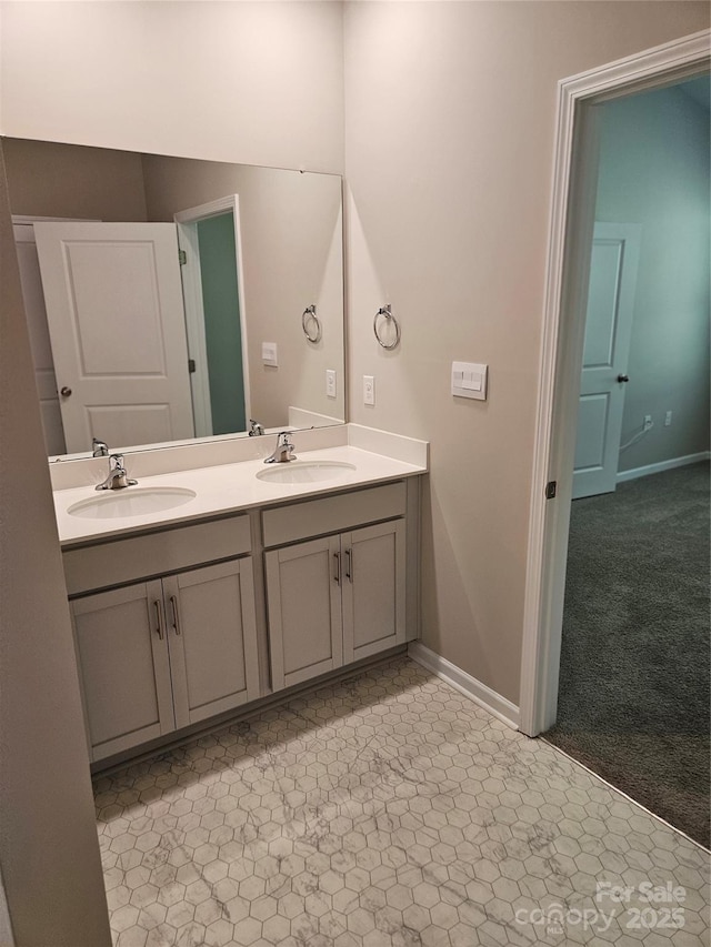 368 Saddlebred Ln, Locust, NC 28097 - bathroom with double vanity and baseboards