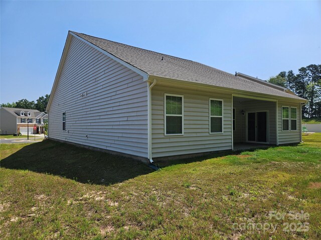 368 Saddlebred Ln, Locust, NC 28097 - back of house with a yard and roof with shingles
