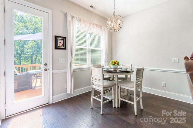 461 Swift Creek Cv, Clover, SC 29710 - dining area featuring a chandelier and dark wood-type flooring