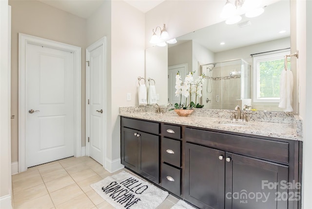 461 Swift Creek Cv, Clover, SC 29710 - full bathroom featuring a shower stall, double vanity, and tile patterned floors