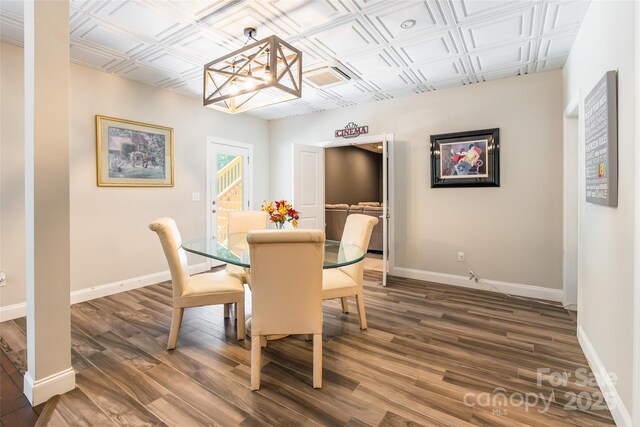 461 Swift Creek Cv, Clover, SC 29710 - dining area with wood finished floors, an ornate ceiling, and a chandelier