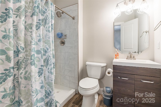 461 Swift Creek Cv, Clover, SC 29710 - bathroom with vanity, a tile shower, and wood finished floors
