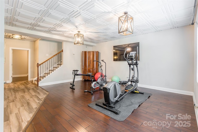 461 Swift Creek Cv, Clover, SC 29710 - exercise room with wood finished floors, a chandelier, and an ornate ceiling