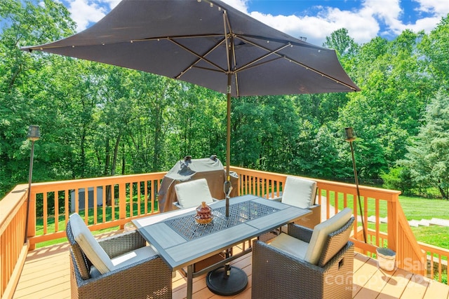 461 Swift Creek Cv, Clover, SC 29710 - wooden terrace featuring outdoor dining area, grilling area, and view of wooded area