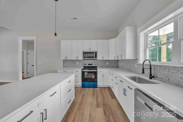 2325 32nd St NE, Hickory, NC 28601 - kitchen with stainless steel appliances, backsplash, and light countertops