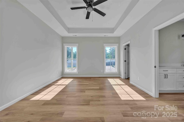 2325 32nd St NE, Hickory, NC 28601 - unfurnished room with a ceiling fan, light wood finished floors, and a raised ceiling