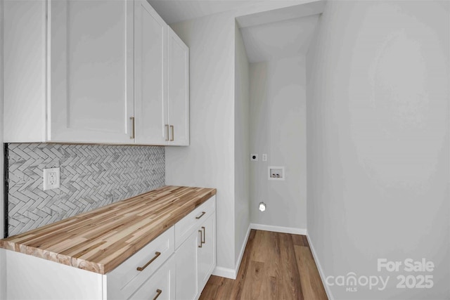 2325 32nd St NE, Hickory, NC 28601 - laundry room featuring hookup for a washing machine, wood finished floors, and hookup for an electric dryer