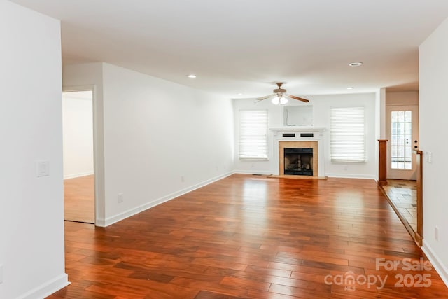 414 Bob Hardin Rd, Rutherfordton, NC 28139 - unfurnished living room featuring a ceiling fan, hardwood / wood-style floors, recessed lighting, and a tiled fireplace