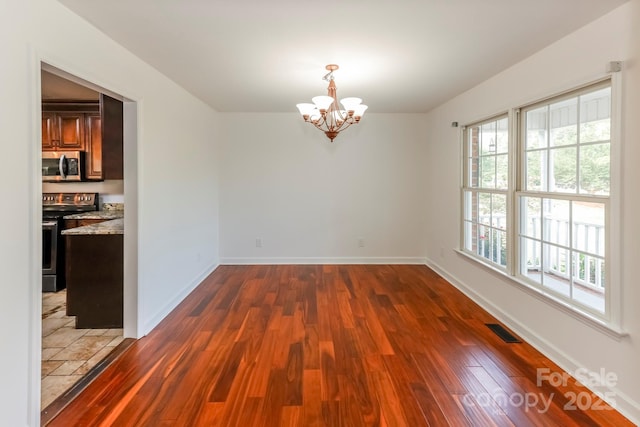414 Bob Hardin Rd, Rutherfordton, NC 28139 - spare room featuring dark wood-style floors and a chandelier