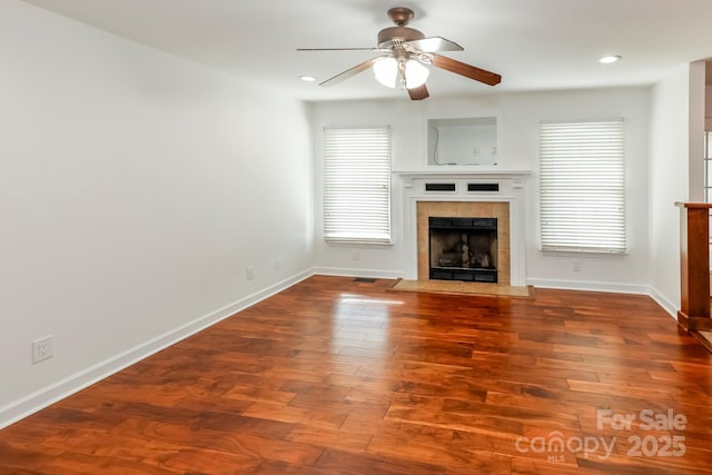414 Bob Hardin Rd, Rutherfordton, NC 28139 - unfurnished living room featuring a ceiling fan, a tiled fireplace, wood finished floors, and recessed lighting