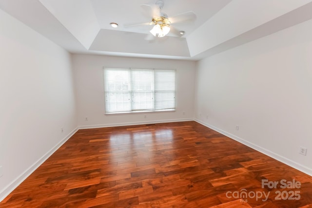 414 Bob Hardin Rd, Rutherfordton, NC 28139 - spare room featuring a tray ceiling, a ceiling fan, and wood finished floors
