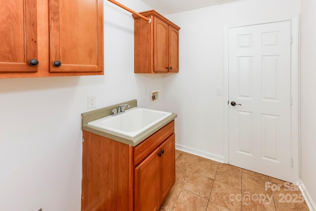 414 Bob Hardin Rd, Rutherfordton, NC 28139 - laundry area featuring washer hookup, cabinet space, and light tile patterned floors