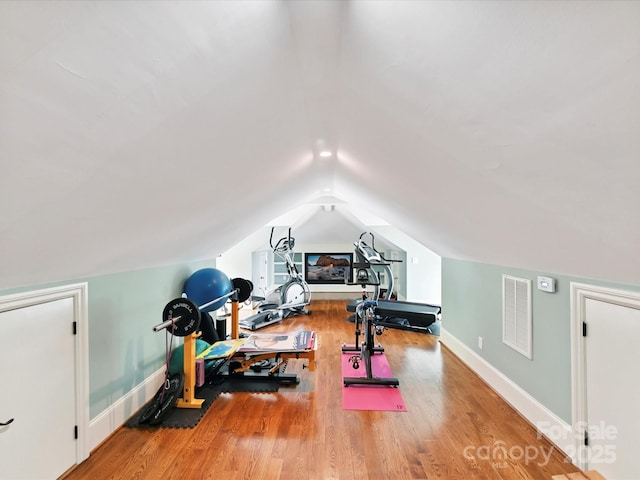 18201 Mainsail Pointe Dr, Cornelius, NC 28031 - workout room featuring vaulted ceiling and wood finished floors