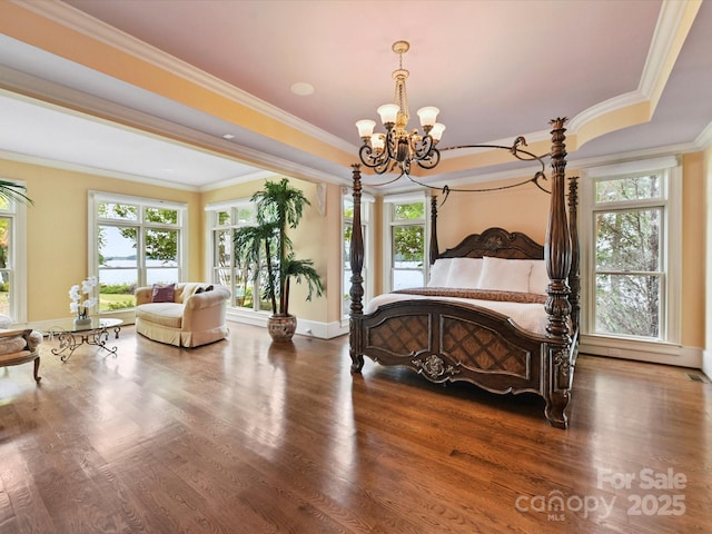 18201 Mainsail Pointe Dr, Cornelius, NC 28031 - bedroom featuring a chandelier, multiple windows, crown molding, and wood finished floors
