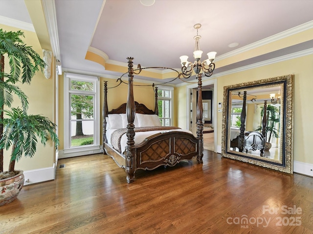 18201 Mainsail Pointe Dr, Cornelius, NC 28031 - bedroom featuring a chandelier, ornamental molding, wood finished floors, and a raised ceiling