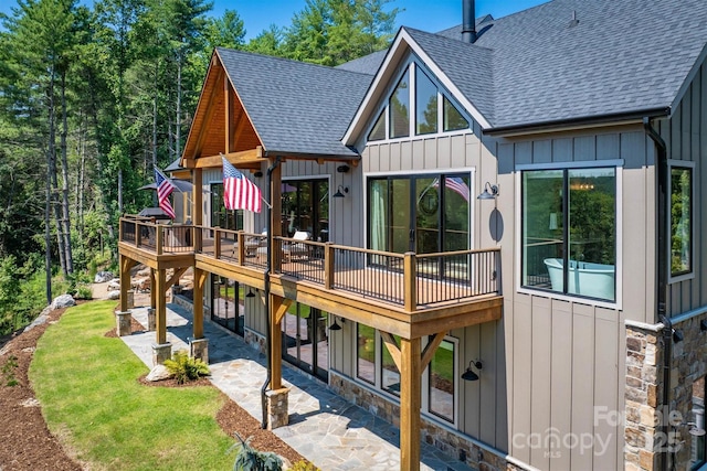 256 Hunt Camp Dr, Nebo, NC 28761 - back of house featuring a shingled roof, board and batten siding, a patio, a deck, and stone siding