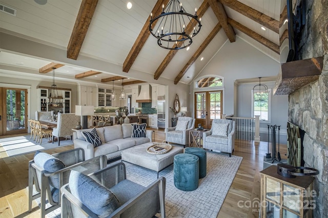 256 Hunt Camp Dr, Nebo, NC 28761 - living room with a chandelier, beamed ceiling, light wood-type flooring, french doors, and recessed lighting