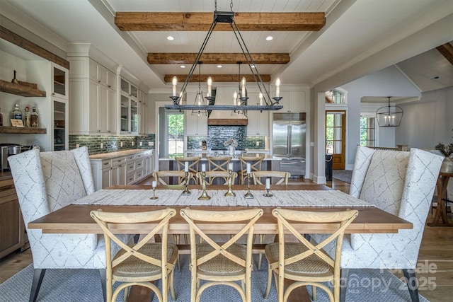 256 Hunt Camp Dr, Nebo, NC 28761 - dining room featuring beamed ceiling, a chandelier, and wood finished floors
