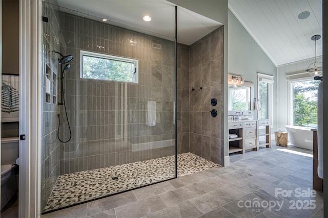 256 Hunt Camp Dr, Nebo, NC 28761 - full bathroom featuring vaulted ceiling, vanity, walk in shower, a soaking tub, and recessed lighting