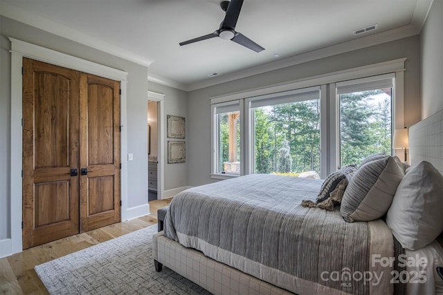 256 Hunt Camp Dr, Nebo, NC 28761 - bedroom featuring ornamental molding, light wood-style flooring, and ceiling fan