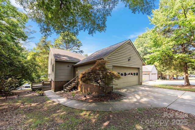 9008 St Croix Ln, Charlotte, NC 28277 - view of side of home featuring a detached garage, stairway, roof with shingles, a deck, and brick siding