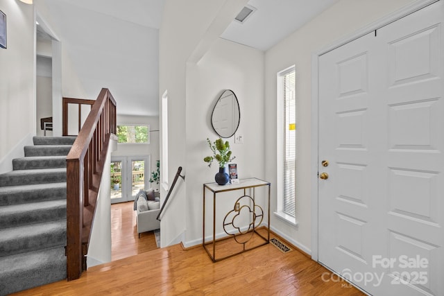 9008 St Croix Ln, Charlotte, NC 28277 - entryway with light wood-style flooring and stairs